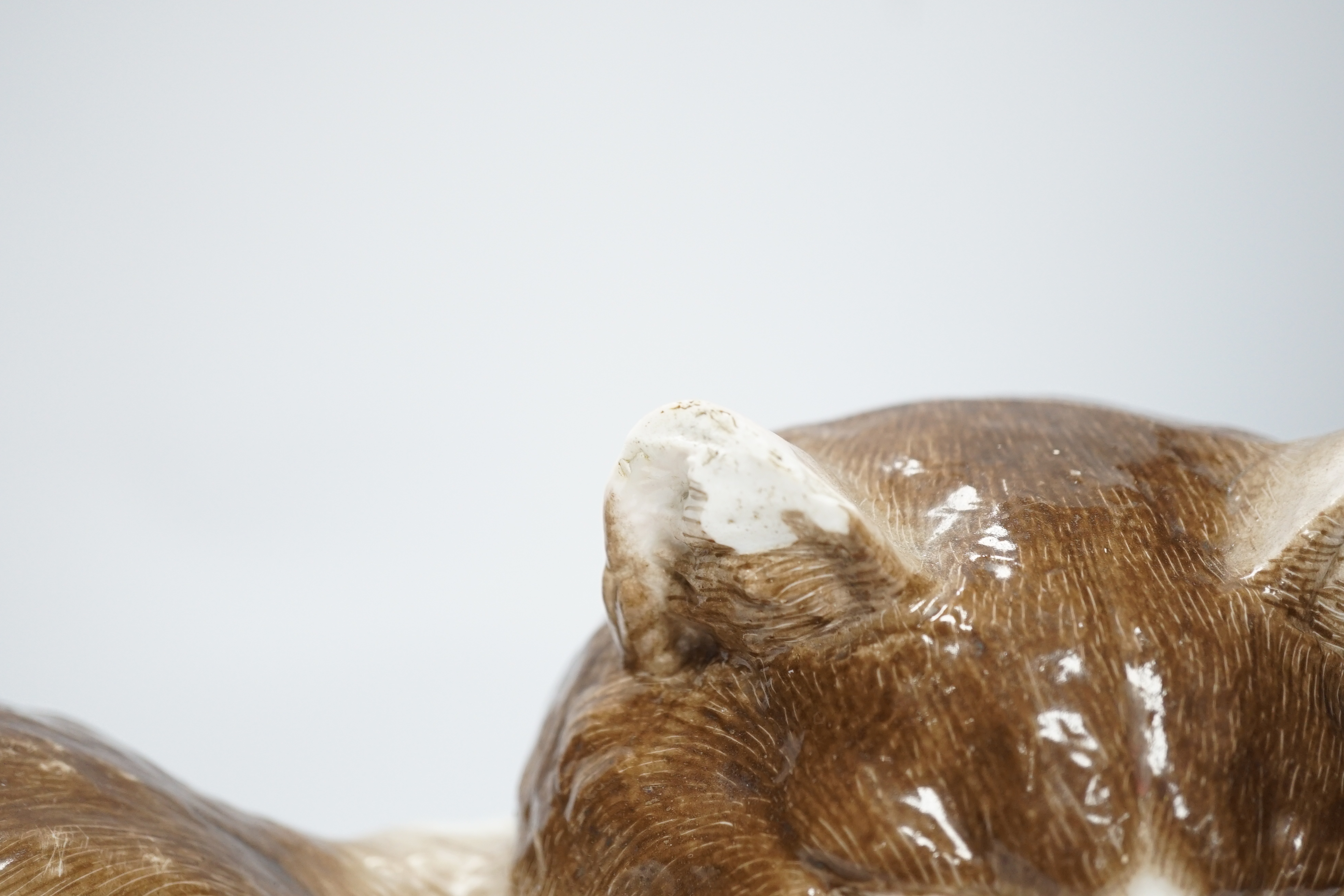 A large Meissen style figure of a seated cat, pseudo crossed swords mark to the base, 37cm wide